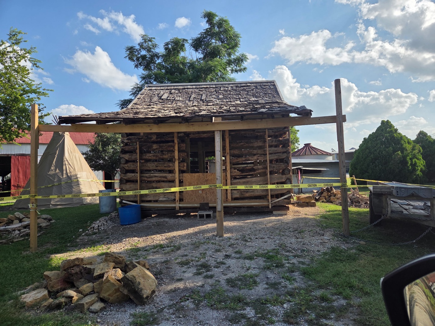 Front of the Campbell Log Cabin braced for restoration