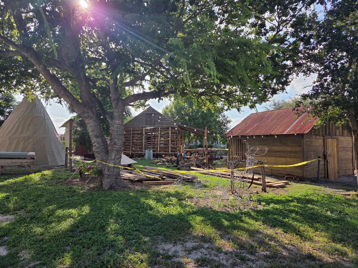 The Campbell Log Cabin among the buildings of the Heritage Village